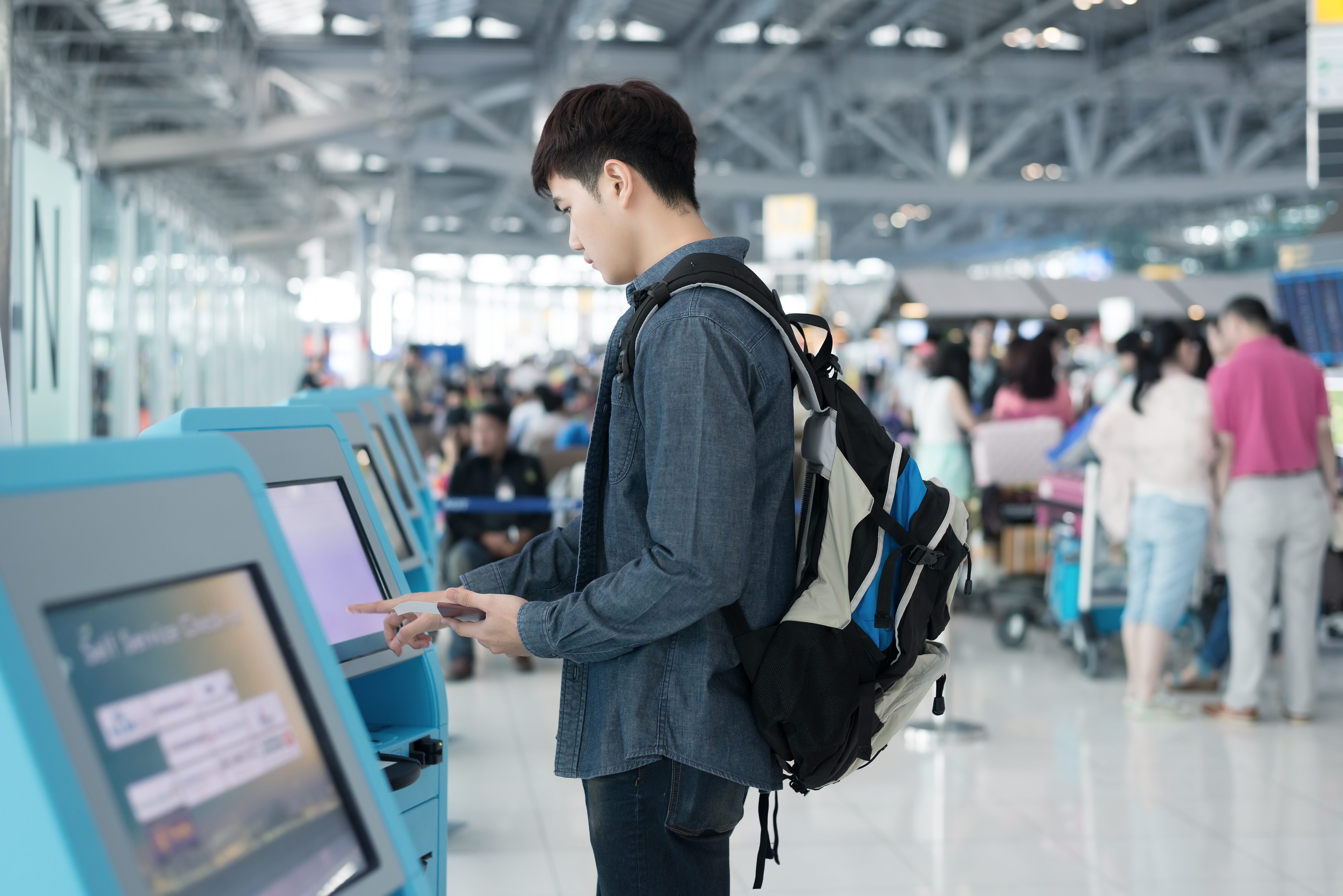 a person using a self-service kiosk